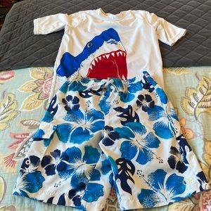 Boys swim trunks small 6/7. Rash guard small 6/7.